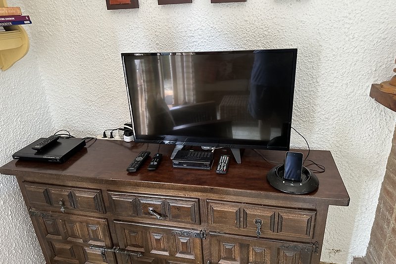 A new television, DVD, satellite and docking station.
