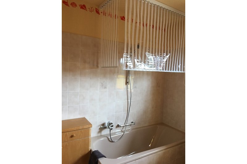 Bathtub with shower curtain