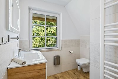 Tuttelduuv unter Reet mit Kamin und Garten