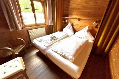 LTD-48 - Holzblockhaus mit überdachter...