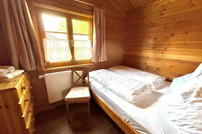 LTD-48 - Holzblockhaus mit überdachter...