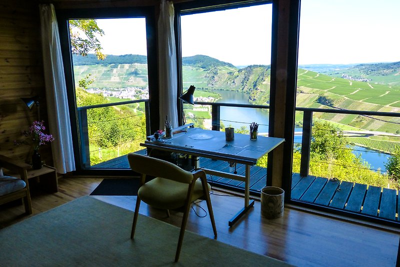 Upper living room with balcony and view of the Moselle.