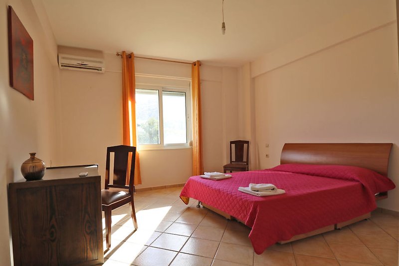 Bedroom with double bed  villa Marilena
