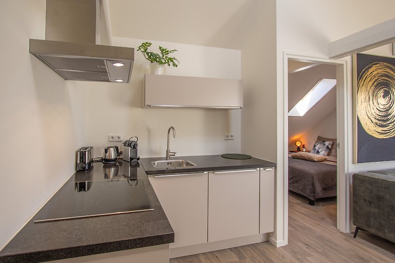 DO44 Moderne Küche, grauen Schränken und stilvollem Design.