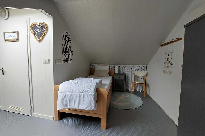 Slaapkamer met een eenpersoonsbed