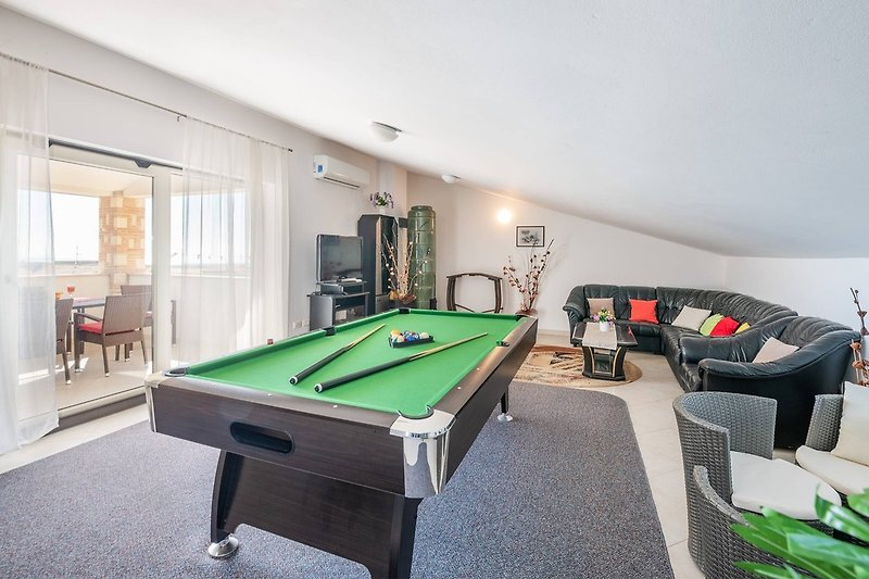 Living room with billiards and table football