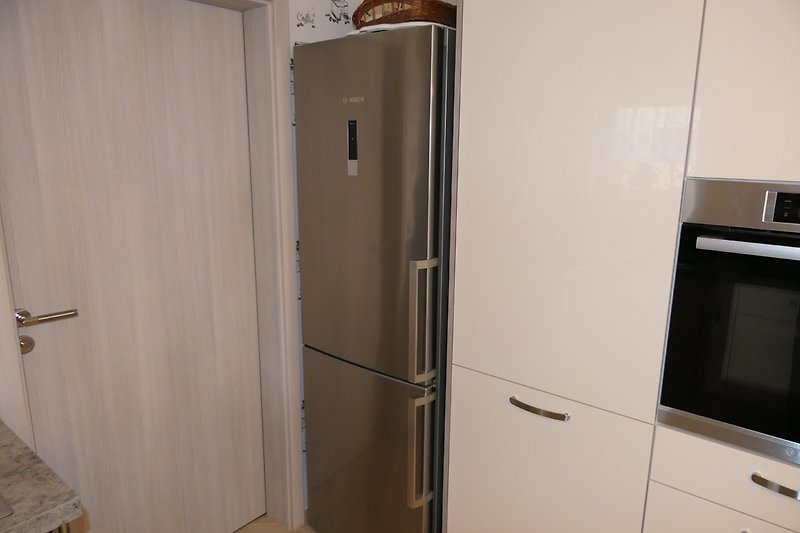 Kitchen with fridge-freezer combination