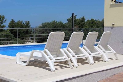 Ferienwohnung mit Poolnutzung und Meerblick