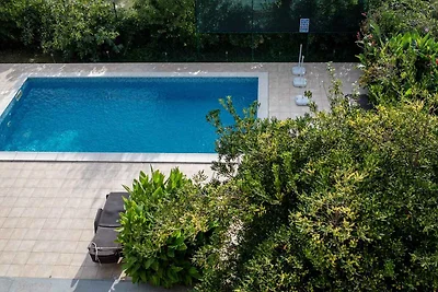 Ferienwohnung mit Pool und Meerblick