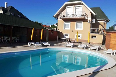 Ferienwohnung medencével és balkonnal