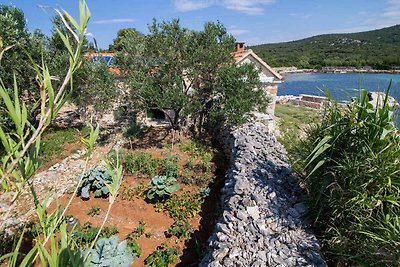 Ferienhaus mit Gartenterrasse und Bootsteg