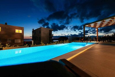 Ferienhaus mit Pool und Meerblick