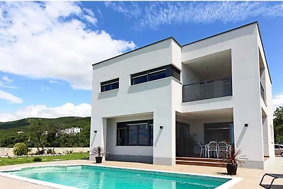 Ferienhaus mit Pool und Meerblick