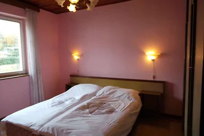 Ferienhaus mit Balkon und Klimaanlage