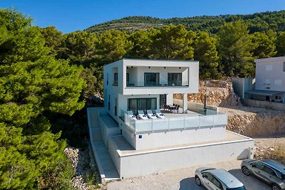 Ferienhaus mit Pool und Meerblick