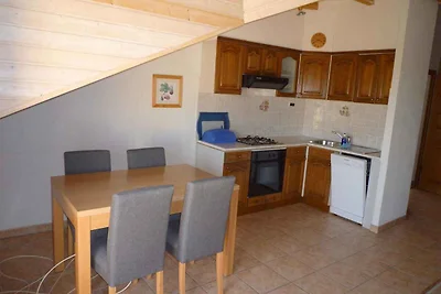 Ferienwohnung mit Gartenmöbeln und Grill