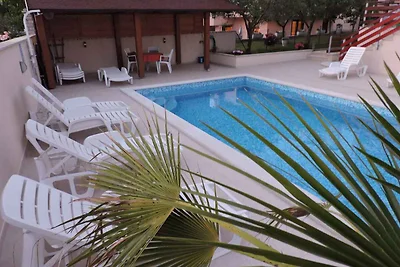 Ferienwohnung mit Aussenpool und Meerblick