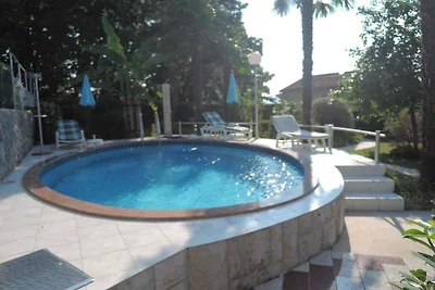 Ferienhaus mit Poolnutzung