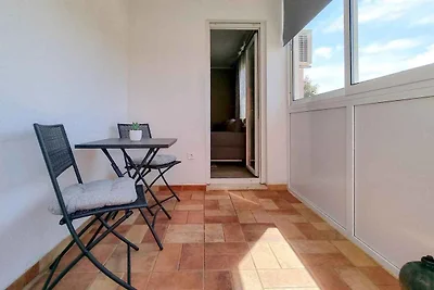 Ferienwohnung mit einer mit Tisch, Stühlen un