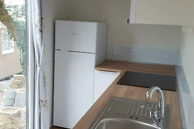 Mobilehome mit halbüberdachter Holzterrasse