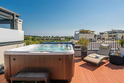 Ferienhaus mit Dachterrasse und Jacuzzi mit S