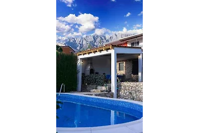 Ferienhaus mit Pool und Blick auf das Meer