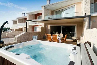 Ferienhaus mit Whirlpool und Meerblick in