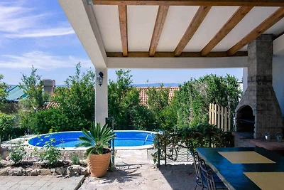 Ferienhaus mit Pool und Blick auf das Meer