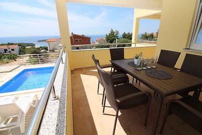 Ferienwohnung mit Poolnutzung und Meerblick
