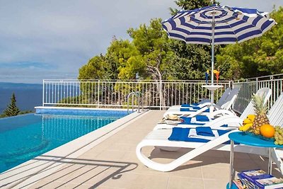Ferienhaus mit Poolnutzung und Meersicht