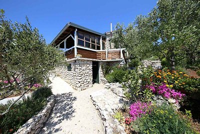 Ferienhaus mit Garten und Meerblick