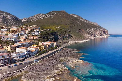 Ferienhaus mit Terrasse direkt am Meer