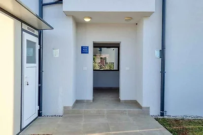 Ferienhaus mit Terrasse und Gartenmöbeln