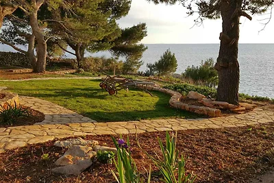 Ferienhaus mit Garten und Meerblick