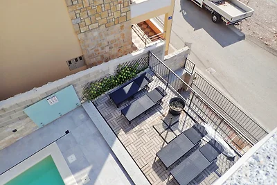 Ferienhaus mit Pool und Meerblick