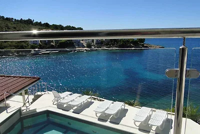 Ferienwohnung mit Poolnutzung und Meerblick