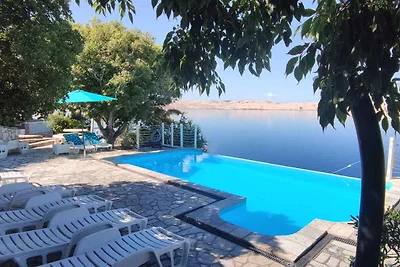 Ferienwohnung mit Poolnutzung und Meerblick