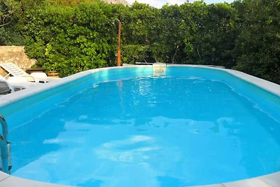 Ferienhaus mit Pool und Blick auf das Meer