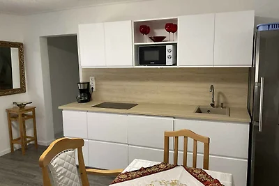Ferienhaus mit Waschmaschine und Ofen im