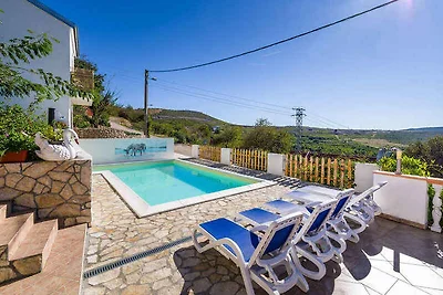 Ferienhaus mit Pool und Meerblick
