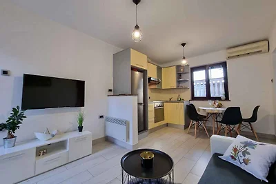 Ferienwohnung mit Garten und Klimaanlage
