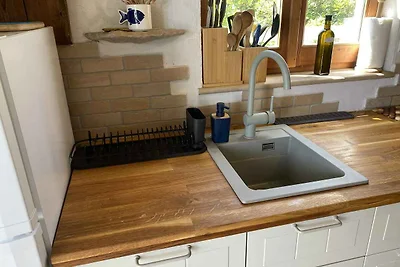 Ferienhaus mit Garten und Meerblick