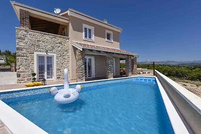 Ferienhaus mit Meerblick und Pool