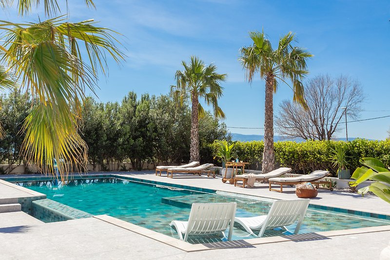 Heated pool with sun loungers