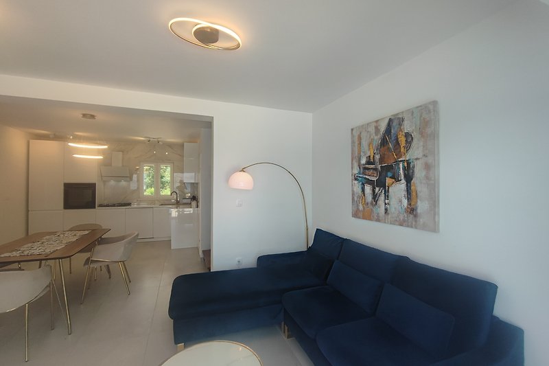 Modern living room with stylish furniture and elegant lighting.