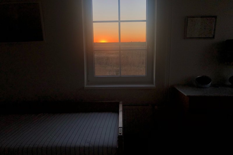 Sonnenuntergang vom Deichzimmer