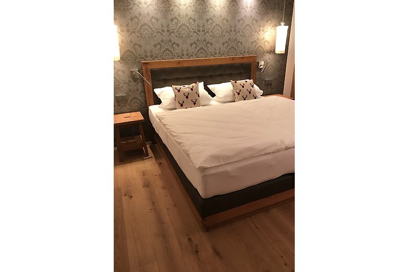 Double room with box spring bed
