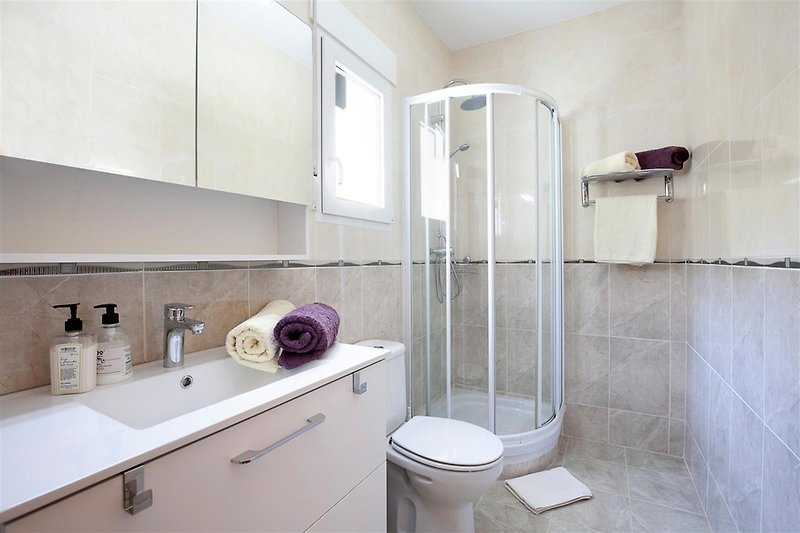 Modern shower bathroom with air conditioning and heating.