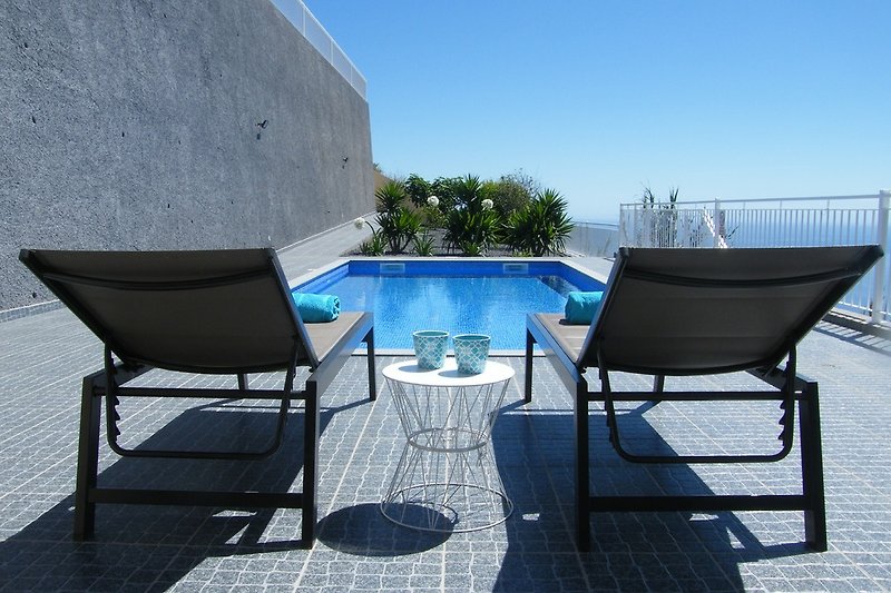 Relax by the pool with sea view and garden view