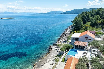 Seafront Villa Mijo by Villas Guide